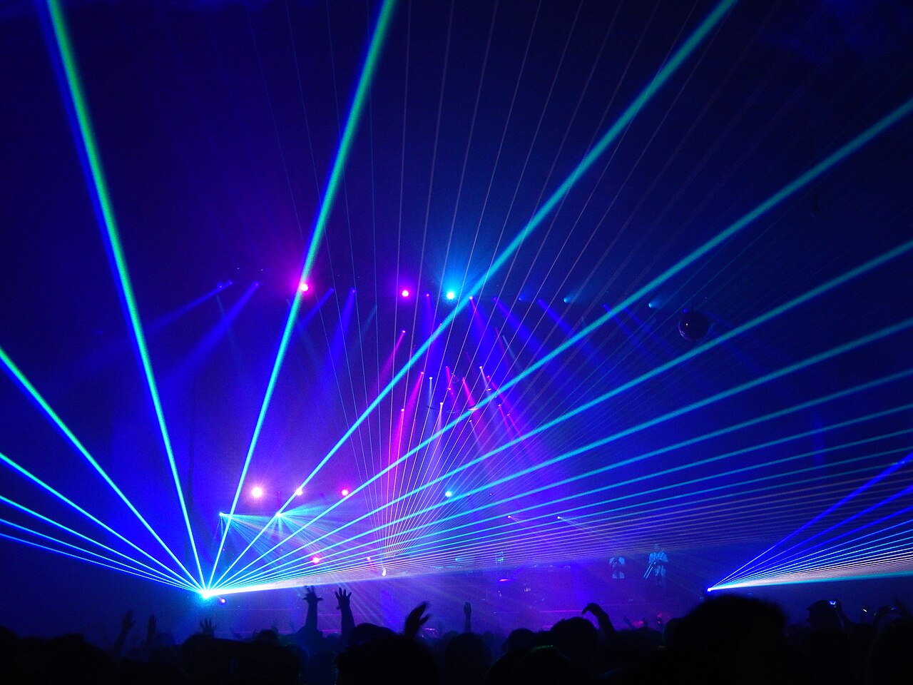 Concert lighting and laser beams above an audience