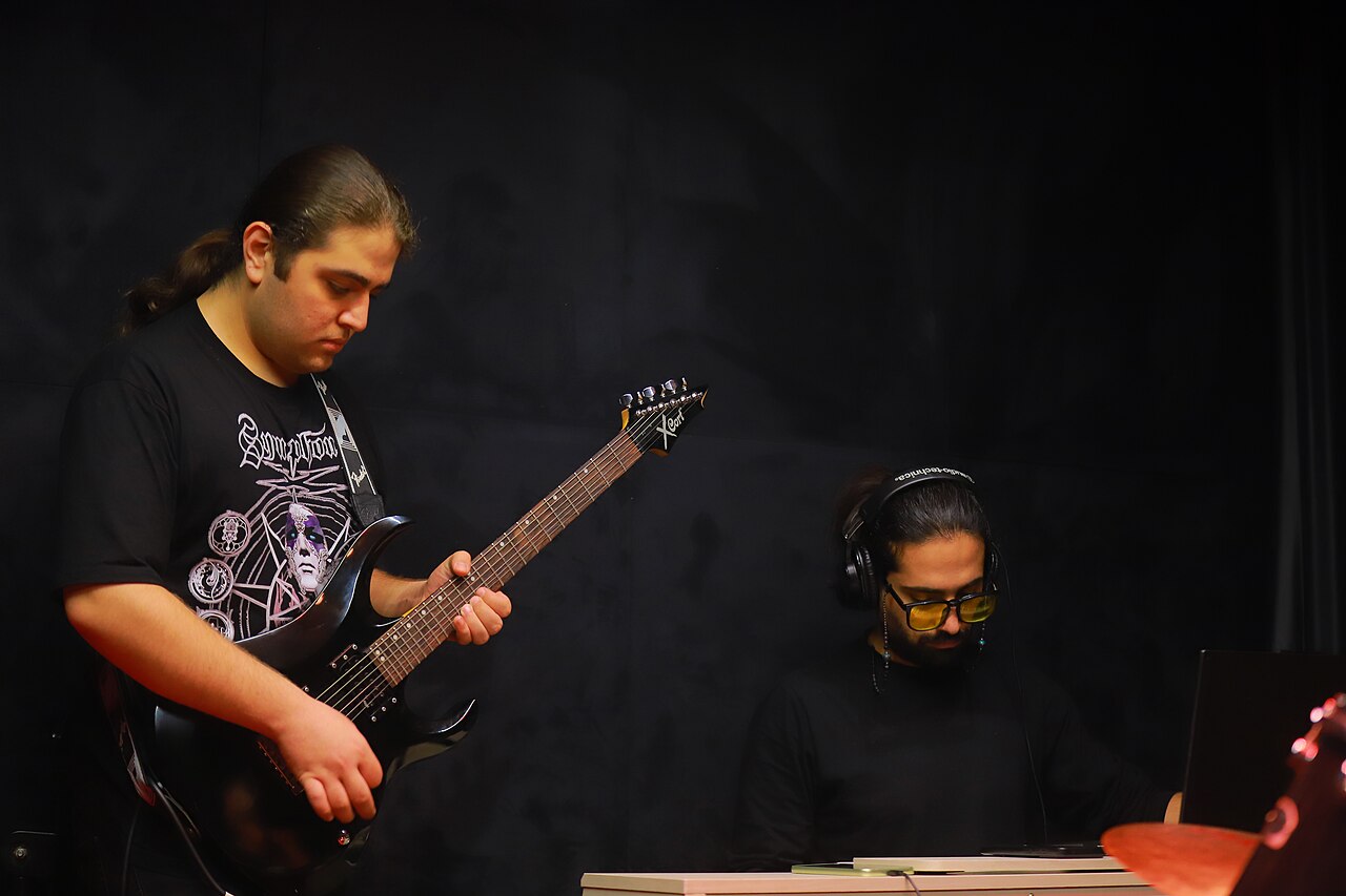 Musicians rehearsing together in a studio