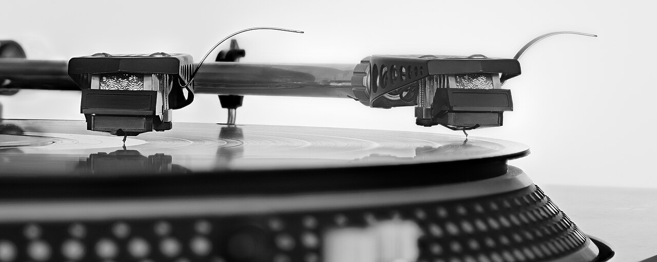 Turntable stylus playing a vinyl record