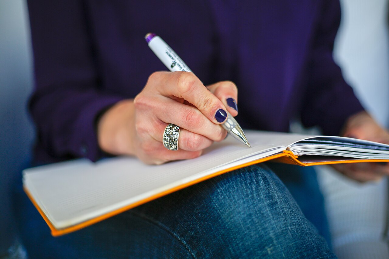 Hand writing in a notebook